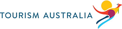 Tourism Australia logo - has the words Tourism Australia then a stylised kangaroo colours of red, orange, blue, cyan and yellow with a yellow sun behind it.