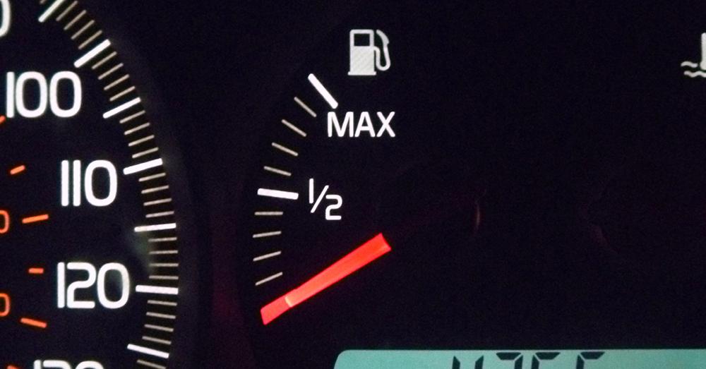 A car's fuel gauge sitting on empty.