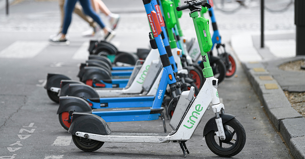 Electric scooters parked and ready to be rented. 