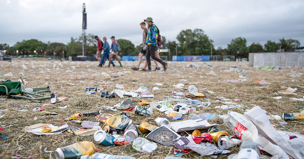 A field covered in litter after a festival/concert.