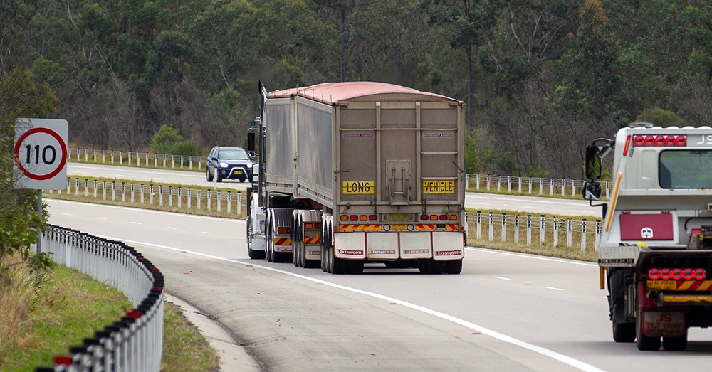 A truck (heading away from the camera) on a national motorway.
