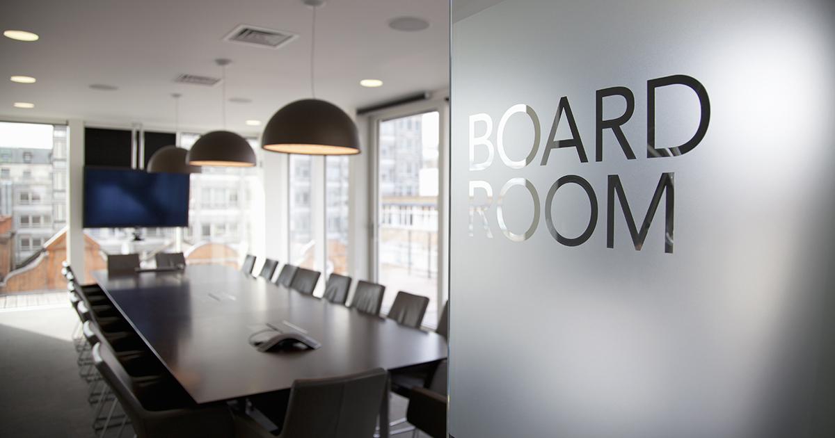 Looking through the main door into an empty boardroom