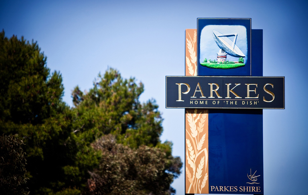 Parkes Shire Council sign that reads Parkes - home of The Dish.