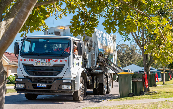 A truck collecting domestic waste in bins in Port Stevens Shire.