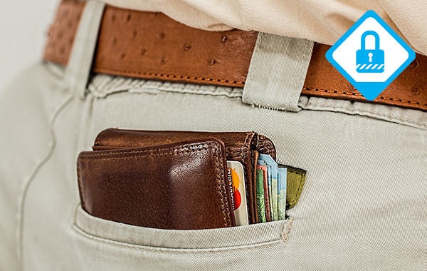 A wallet full of cash and credit cars in a man's back trouser pocket.