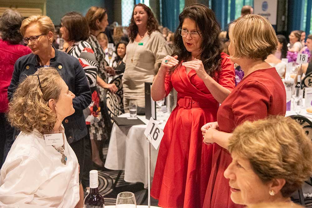 Annabel Crabb speaks to one of the guests at the LGNSW 2021 International Women's Day lunch.